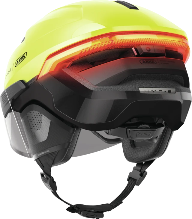 Kask rowerowy z kierunkowskazami i światłem hamowania Abus Hyp-E BL.ACE Signal Yellow