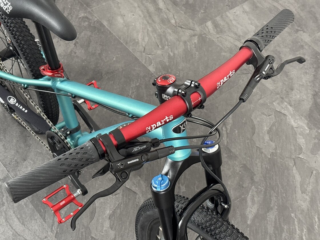 Lekki rowerek amortyzowany KUbikes 20 S MTB DISC turkusowy + laser red